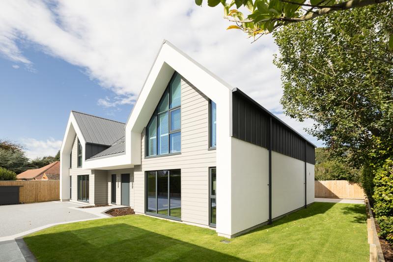 Side view of home with standing seam cladding