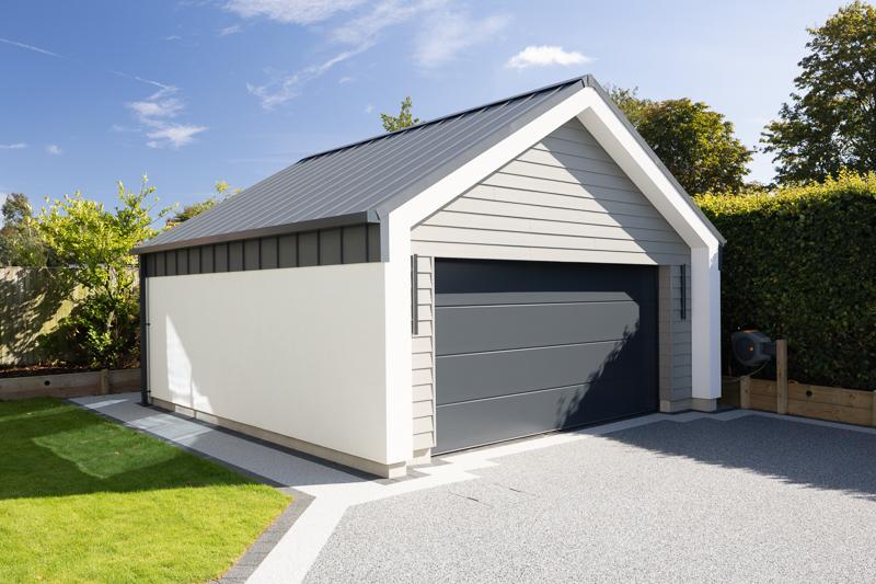 Garage outbuilding with matching standing seam roof